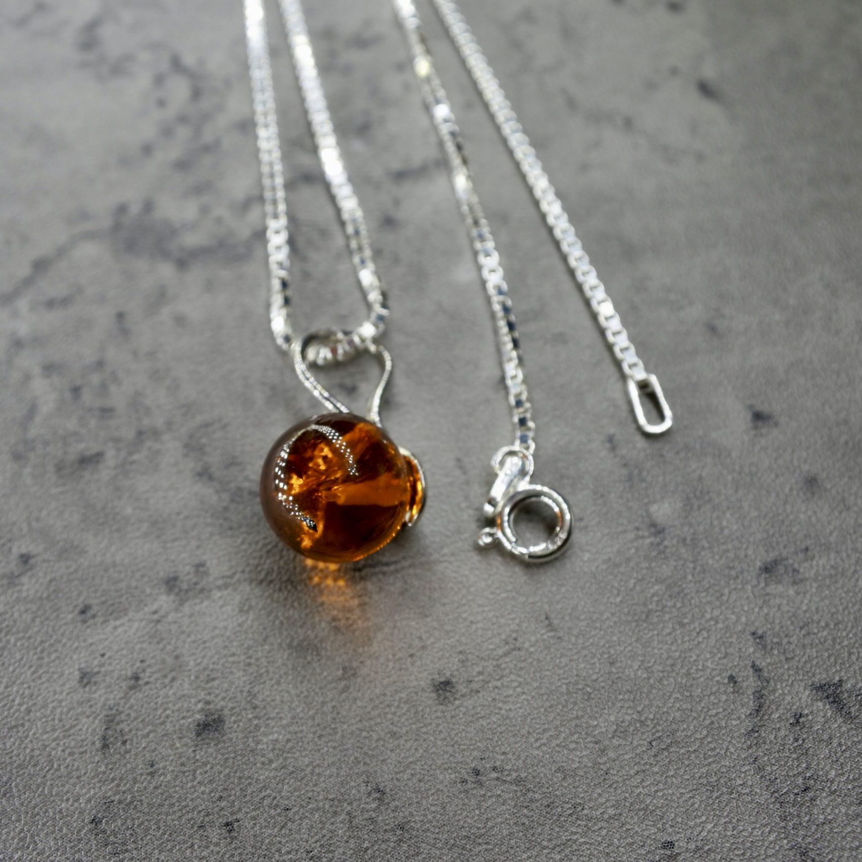 Amber globus stone silver